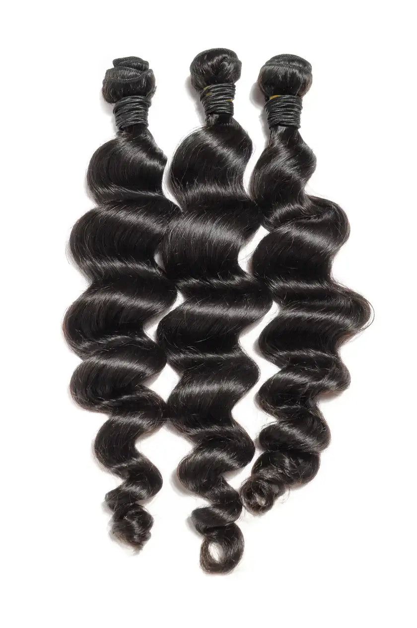 3 Bundle Loose Wave Set featuring three beautiful, natural Brazilian loose wave bundles.